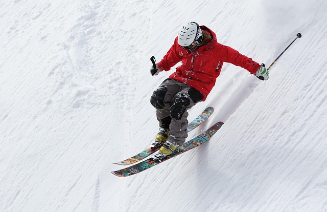 Skier speeding down a snowy mountain slope